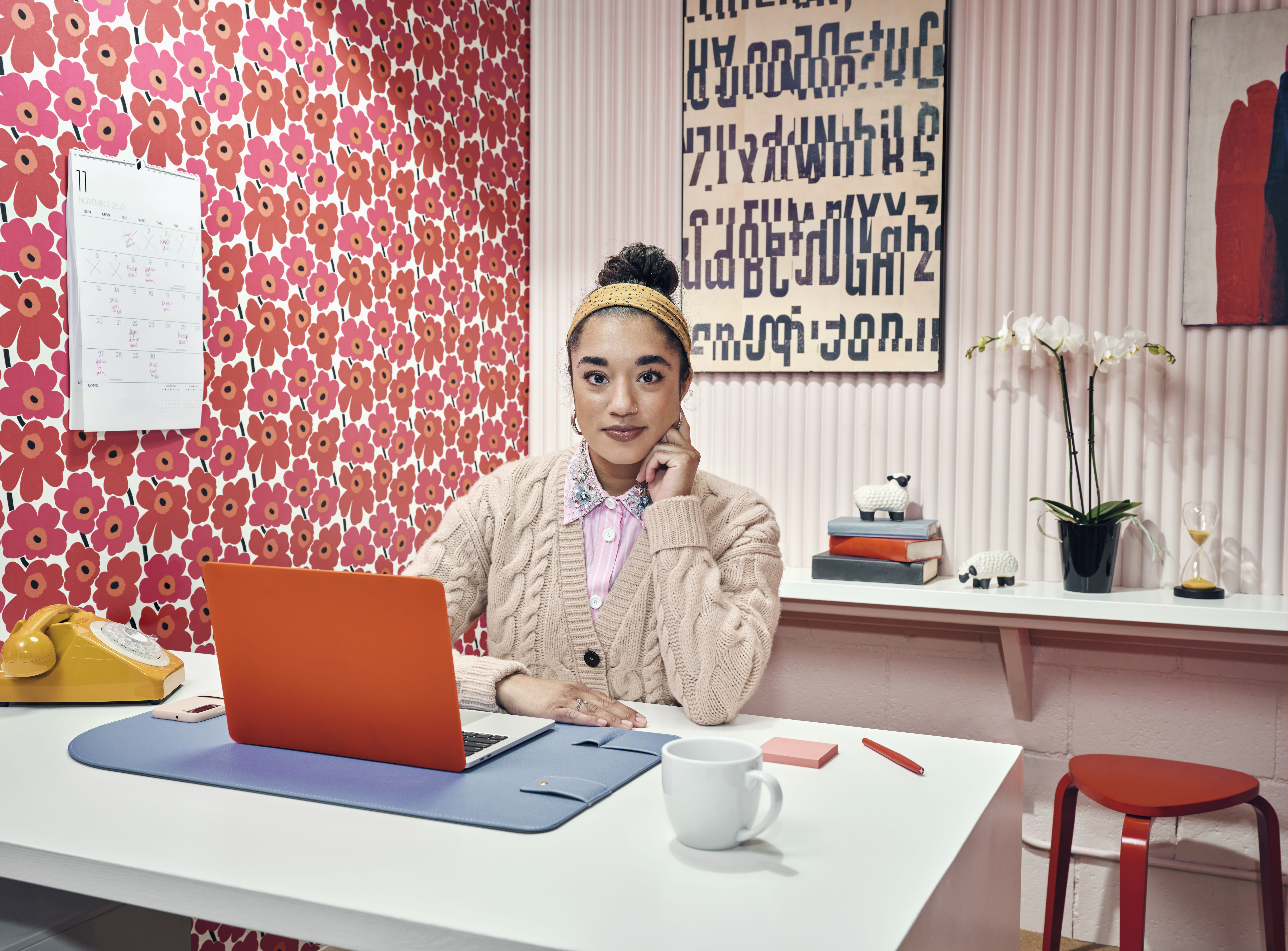 Woman sitting at an office desk and working on a laptop