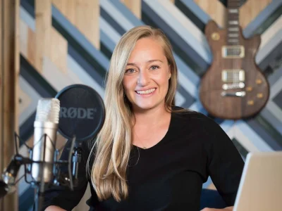 A professional female voice over for your podcast intro and outro