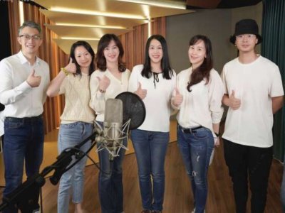 Team of voice actors with both male and female voices for recordings.
