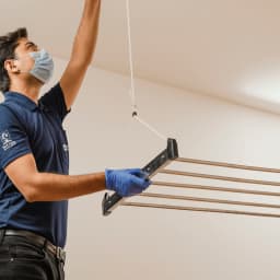 Clothes' hanger - Ceiling-mounted hanger installation