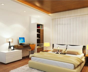 Brown Shaded Bedroom With Wooden False Ceiling And Standing