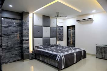 Grey Themed Bedroom With Queen Size Bed And Grey Cushioned