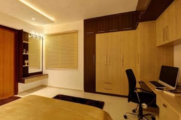 Spacious Master Bedroom With Wooden Finished Wardrobe And