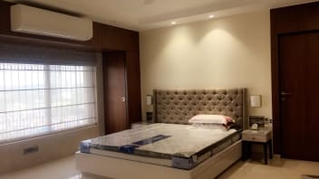 Stylish Bedroom With White Low Floor Bed And Built In Lights By