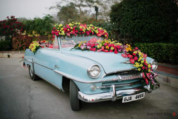 A Splendid Vintage Car Decor With Multi Colored Flower Decoration