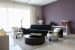 Contrasting Living Room Space With Black Mid-Century Modern Sofa by Sakshi Gugnani Living-room Modern | Interior Design Photos & Ideas