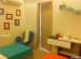 Vibrant kid's room with blue wall racks and wooden play desk by Interior Wizards Bedroom Contemporary | Interior Design Photos & Ideas