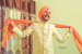 Intricate Off White Sherwani With Pearl Beads Completing Its Look With Orange Turban by Sourab Sharma Wedding-photography Groom-wear-and-accessories | Weddings Photos & Ideas