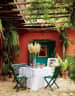Outdoor Dining Area In A Veranda with peach colored walls by Tanya Anand Open-spaces Vintage | Interior Design Photos & Ideas