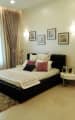 All White Bedroom with Artistic Bed by Eureka Interiors Bedroom Contemporary | Interior Design Photos & Ideas