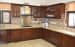 L shaped kitchen with cream granite counter top and wooden base and wall cabinet by Kiran Hanumaiah Modular-kitchen Contemporary | Interior Design Photos & Ideas