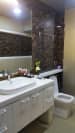 Bathroom with Black Patterned Granite and White Cabinets by Alaya D'Decor Bathroom Modern | Interior Design Photos & Ideas