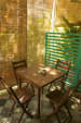 Veranda With Light Brown Shaded Wooden Patio Chairs and Table by Viraf Laskari Modern | Interior Design Photos & Ideas