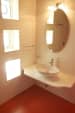Elegant Bathroom with White Polished Washbasin and Round Mirror by Viraf Laskari Bathroom Contemporary | Interior Design Photos & Ideas