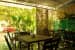Stunning cafeteria Space with Wooden Tables and Chairs along with Outside View by Viraf Laskari Modern | Interior Design Photos & Ideas