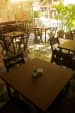 Outdoor Seating Area With Wooden Table And Chairs by Viraf Laskari Modern | Interior Design Photos & Ideas