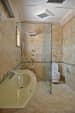Bathroom With Textured Marble Flooring and Glass Shower Door by Viraf Laskari Bathroom Modern | Interior Design Photos & Ideas