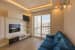 Living Room With Blue Sofa And Wooden Display Unit by Furdo.com Living-room Minimalistic | Interior Design Photos & Ideas