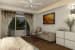 Bed with grey sofa and false ceiling by Regalias Interiors Bedroom Contemporary | Interior Design Photos & Ideas