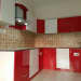 Red And White Themed Modular Kitchen With Cubical Brown Tiles by VJP. DECORS Modular-kitchen Contemporary | Interior Design Photos & Ideas