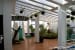 Beautiful Open Space with Brown Tiled Floor And Hanging Plants by Ogling Inches Design Architects Open-spaces Modern | Interior Design Photos & Ideas