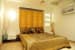Well Illuminated Guestroom with White Themed Wall and Light Oak Wood Flooring by Shristi Interiors Bedroom Modern | Interior Design Photos & Ideas