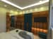 Bedroom With Cream White Walls And TV Unit Hinged To Wooden Panel by Umesh Vishwakarma Bedroom Contemporary | Interior Design Photos & Ideas