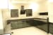 L shaped kitchen with black granite top and polished black base cabinets by Entrix Shahkir Shaik Modular-kitchen Modern | Interior Design Photos & Ideas