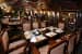 Sophisticated Restaurant with Wooden Table and Chair by Mayank Manchanda Contemporary | Interior Design Photos & Ideas