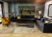 Distinctive Living Area with Black Sofa Set and Golden Colored Chair by Mayank Manchanda Living-room Eclectic | Interior Design Photos & Ideas