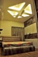 Bedroom With Oak Wooden Flooring And Printed Headboard by Rohit Mangal Singla Bedroom Modern | Interior Design Photos & Ideas