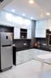 Modular Kitchen with White Cabinets and Black Counter Top by Rohit Mangal Singla Modular-kitchen Modern | Interior Design Photos & Ideas
