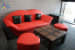Living space with red sofa and black cushion by Vishal Arora Living-room Minimalistic | Interior Design Photos & Ideas