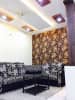Living room decorated with white,grey and black print L shaped sofa,golden floral print wallpaper and decorative false ceiling with ceiling lights by Chaitanya Challa Living-room Eclectic | Interior Design Photos & Ideas