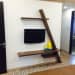 Artistic wall mounted wooden TV cabinet by Chaitanya Challa Bedroom Minimalistic | Interior Design Photos & Ideas