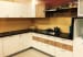 Beige And White Wooden Cabinets Of Modern Kitchen by Supravat Harza Modular-kitchen Modern | Interior Design Photos & Ideas