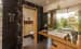 Bathroom With Wooden Cabinets And Black Marble Floor by narayan moorthy Bathroom Contemporary | Interior Design Photos & Ideas