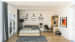 White walled bedroom with Queen sized bed,hardwood flooring and computer table by Sakina Azher Bedroom Modern | Interior Design Photos & Ideas