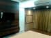 Bedroom With Pale Yellow Curtains And TV Unit by Dhananjay Ramdas Bedroom Minimalistic | Interior Design Photos & Ideas