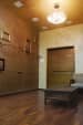Wooden floored living room with Golden textured wallpaper and false ceiling by Janaki Kumar Raut Living-room Minimalistic | Interior Design Photos & Ideas