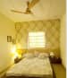 Olive green themed room with Beige leaf print walls by Sarath Sasi P Bedroom Contemporary | Interior Design Photos & Ideas