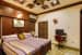 Master Bedroom with Wooden King Size Bed and Edgy False Ceiling by Monnaie Architects Bedroom Contemporary | Interior Design Photos & Ideas