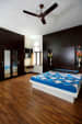 Commodious Master Bedroom with Wood Flooring and King Size Bed by Monnaie Architects Bedroom Contemporary | Interior Design Photos & Ideas