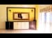 Living Room with Brown Yellow Contrast Entertainment Unit and Outdoor Window View by Mauve & Crimson Interior Solutions Living-room Modern | Interior Design Photos & Ideas