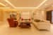 White Cushioned Sofas With Orange Recliner by Sagar Shah Living-room Minimalistic | Interior Design Photos & Ideas