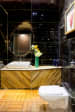 Luxurious Bathroom Space With Wooden Flooring and Black Marble Wall by Dhaval Patel Bathroom Modern | Interior Design Photos & Ideas