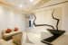 Angle influenced living room with a hint of Orange and with Arm rest free Sectional sofa and LED lit false ceiling by Awan Ahmad Khan Living-room Minimalistic | Interior Design Photos & Ideas