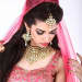 Kundan embedded jewelry complementing the pretty pink bridal attire!