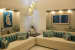 Beige Sofas And Yellow Cylindrical Lights by Nestopia Living-room Modern | Interior Design Photos & Ideas