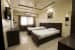 Bedroom with Single Beds and Wooden Finished Furniture by Trupti Ladda Bedroom Minimalistic | Interior Design Photos & Ideas